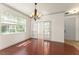 Bright dining room featuring hardwood floors and glass doors, creating a seamless flow and access at 3752 Cleary Way, Orlando, FL 32828