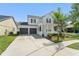 Charming two-story home featuring a well-manicured front yard and a spacious two-car garage at 3752 Cleary Way, Orlando, FL 32828