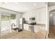 Bright kitchen featuring stainless steel appliances, granite countertops, and ample cabinet space at 3752 Cleary Way, Orlando, FL 32828