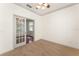 Home office features neutral carpet, white walls, and French doors at 3752 Cleary Way, Orlando, FL 32828