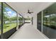 Wide screened patio with ceiling fans, offering expansive views of the backyard at 3752 Cleary Way, Orlando, FL 32828