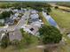 Aerial view of residential neighborhood with pond, golf course, and well-maintained landscaping at 3780 Ventura Cove Dr, Orlando, FL 32822