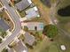 Aerial view of a single-Gathering home featuring a screened-in pool and well-maintained landscaping at 3780 Ventura Cove Dr, Orlando, FL 32822