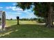 Expansive lawn with mature shade tree overlooking a view of the golf course at 3780 Ventura Cove Dr, Orlando, FL 32822