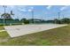 Community basketball court offers recreational enjoyment with shaded seating areas and green surroundings at 3780 Ventura Cove Dr, Orlando, FL 32822