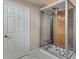 Modern bathroom with a glass enclosed walk-in shower with two stools at 3780 Ventura Cove Dr, Orlando, FL 32822