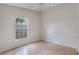 Cozy bedroom with neutral walls, hardwood floors and a large window at 3780 Ventura Cove Dr, Orlando, FL 32822