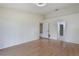 Bright bedroom featuring hardwood floors and a double door closet at 3780 Ventura Cove Dr, Orlando, FL 32822