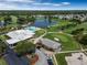 Aerial view showcasing the community clubhouse, pool, golf course, and surrounding residential area at 3780 Ventura Cove Dr, Orlando, FL 32822