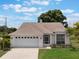 Charming home featuring a two-car garage, screened porch, and well-manicured lawn at 3780 Ventura Cove Dr, Orlando, FL 32822