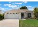Charming single-story home features a two-car garage, well-manicured lawn, and bright exterior at 3780 Ventura Cove Dr, Orlando, FL 32822
