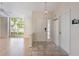 Bright foyer with a tile floor and access to the living room featuring beautiful natural light at 3780 Ventura Cove Dr, Orlando, FL 32822