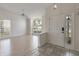 Bright and airy living room featuring tile entryway, laminate floors, ceiling fan, and natural light at 3780 Ventura Cove Dr, Orlando, FL 32822