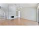 Spacious living room with hardwood floors, fireplace, and sliding glass doors to the outdoors at 3780 Ventura Cove Dr, Orlando, FL 32822