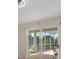 Sliding glass doors opening to screened patio with wooded backyard view at 3780 Ventura Cove Dr, Orlando, FL 32822