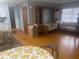 Hardwood floors throughout this open living area with natural light from the windows at 404 E Kentucky Ave, Deland, FL 32724