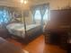 Cozy main bedroom features a bed, desk, and traditional furnishings at 404 E Kentucky Ave, Deland, FL 32724