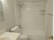 Bright, tiled bathroom features a toilet and shower-tub combination with updated fixtures at 4109 Fairview Vista Pt # 315, Orlando, FL 32804