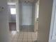 Inviting hallway featuring tile flooring that leads to other areas of the home at 4109 Fairview Vista Pt # 315, Orlando, FL 32804
