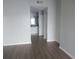 Hallway leading to a bathroom with a vanity and large mirror and another bedroom at 4109 Fairview Vista Pt # 315, Orlando, FL 32804