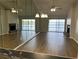 Bright living room with fireplace, wood flooring, ceiling fan and water view at 4109 Fairview Vista Pt # 315, Orlando, FL 32804