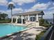 Relax poolside with shaded seating, lounge chairs, and a view of the lake at 4109 Fairview Vista Pt # 315, Orlando, FL 32804