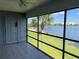 Enjoy waterfront views from this condo's screened porch with views of the beach and palm trees at 4109 Fairview Vista Pt # 315, Orlando, FL 32804