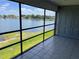 Screened-in porch overlooking a picturesque waterfront view, perfect for relaxing outdoors at 4109 Fairview Vista Pt # 315, Orlando, FL 32804