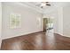 Bedroom with wood floors, tray ceiling, and sliding glass door at 453 Kays Landing Dr, Sanford, FL 32771