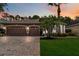 Charming home featuring a three-car garage, brick driveway, and beautifully landscaped front yard with mature palms at 453 Kays Landing Dr, Sanford, FL 32771