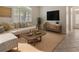 Comfortable living room featuring a neutral color palette, large windows, and stylish furniture at 453 Kays Landing Dr, Sanford, FL 32771