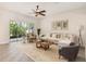 Bright and airy living room with large sliding glass doors, neutral furniture, and a decorative rug at 453 Kays Landing Dr, Sanford, FL 32771
