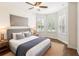 The main bedroom features bay windows, wood-style floors, a ceiling fan, and neutral tones at 453 Kays Landing Dr, Sanford, FL 32771