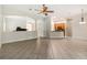Spacious open floor plan with tiled flooring and a view of the kitchen and living areas at 453 Kays Landing Dr, Sanford, FL 32771