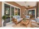 Comfortable outdoor seating area with neutral decor and a ceiling fan at 453 Kays Landing Dr, Sanford, FL 32771
