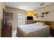 Cozy bedroom with neutral paint and tile floors at 4561 Heritage Oak Dr, Orlando, FL 32808