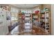 Dining area features wooden table with chairs, shelving, and natural light from the windows at 4561 Heritage Oak Dr, Orlando, FL 32808