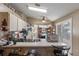 Eat-in kitchen features white cabinets and appliances, plenty of storage, and a sliding door at 4561 Heritage Oak Dr, Orlando, FL 32808