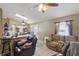 Open-concept living room featuring tile floors, neutral walls, and comfortable seating at 4561 Heritage Oak Dr, Orlando, FL 32808