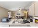 Open-concept living room and kitchen featuring neutral walls, tile floors, and lots of natural light at 4561 Heritage Oak Dr, Orlando, FL 32808