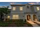 Well-maintained two-story home featuring manicured landscaping and an inviting entryway at 4983 Windermere Ave, Kissimmee, FL 34746