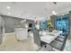 Open dining area with modern decor, seamlessly blending with the kitchen and living room at 4983 Windermere Ave, Kissimmee, FL 34746