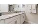 Bathroom featuring double sinks and a quartz countertop at 4983 Windermere Ave, Kissimmee, FL 34746
