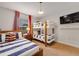 Bright ' bedroom with nautical-themed bedding and bunk beds at 4983 Windermere Ave, Kissimmee, FL 34746