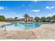 Large community pool featuring a clubhouse and ample lounge seating at 4983 Windermere Ave, Kissimmee, FL 34746