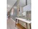 Hallway with decorator table and accents; a mirror adds dimension at 4983 Windermere Ave, Kissimmee, FL 34746