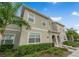 Inviting two-story home with meticulously landscaped front yard and charming architectural details at 4983 Windermere Ave, Kissimmee, FL 34746