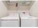Well-lit laundry room equipped with a modern washer and dryer set at 4983 Windermere Ave, Kissimmee, FL 34746