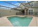 Sparkling screened-in pool provides the perfect backyard retreat at 4983 Windermere Ave, Kissimmee, FL 34746