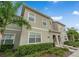 Charming two-story home with a well-maintained lawn and lush landscaping at 4983 Windermere Ave, Kissimmee, FL 34746